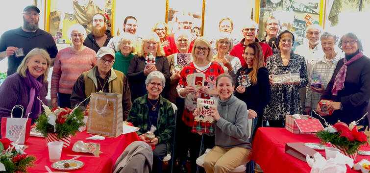 Susquehanna Art Society group photo. Members are holding gifts in their hands.